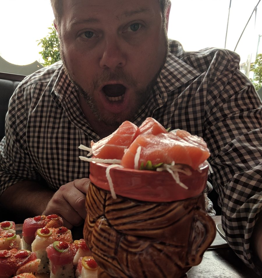 John with a plate of sushi